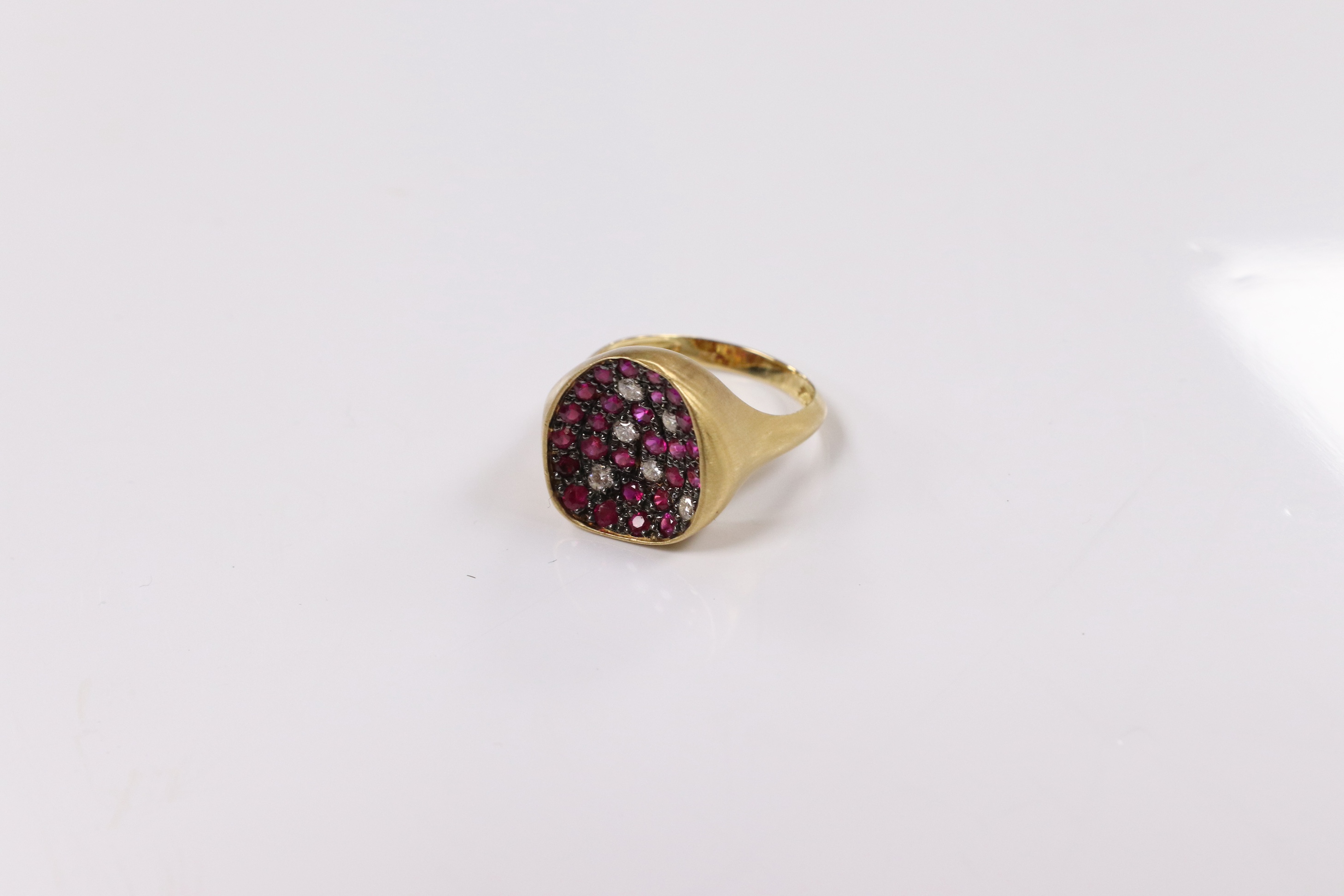 A modern 18k and pave set ruby and diamond set concave dress ring, size O, gross weight 5.4 grams. Condition - fair